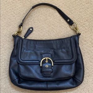 COACH black leather satchel handbag.
